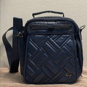 Lug Flapper SE, Metallic Indigo measures 8”x9”x3.5”
